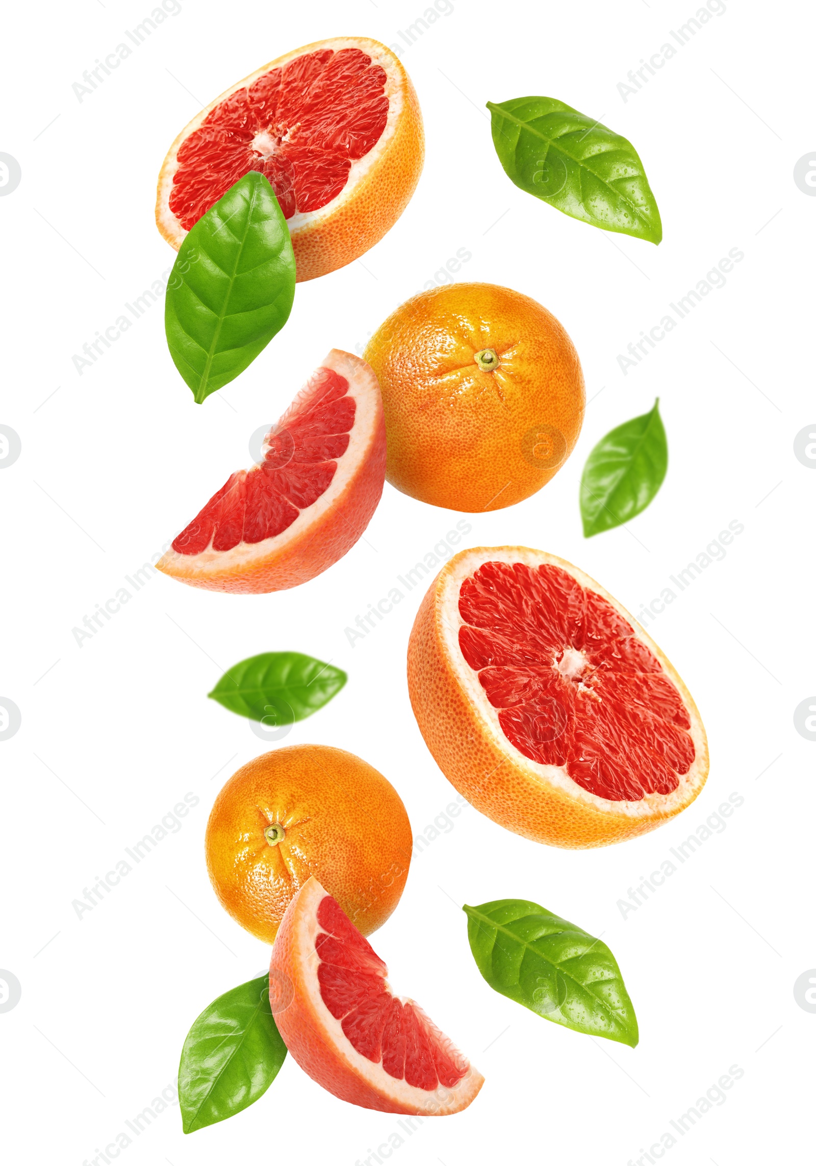 Image of Tasty ripe grapefruits and green leaves falling on white background