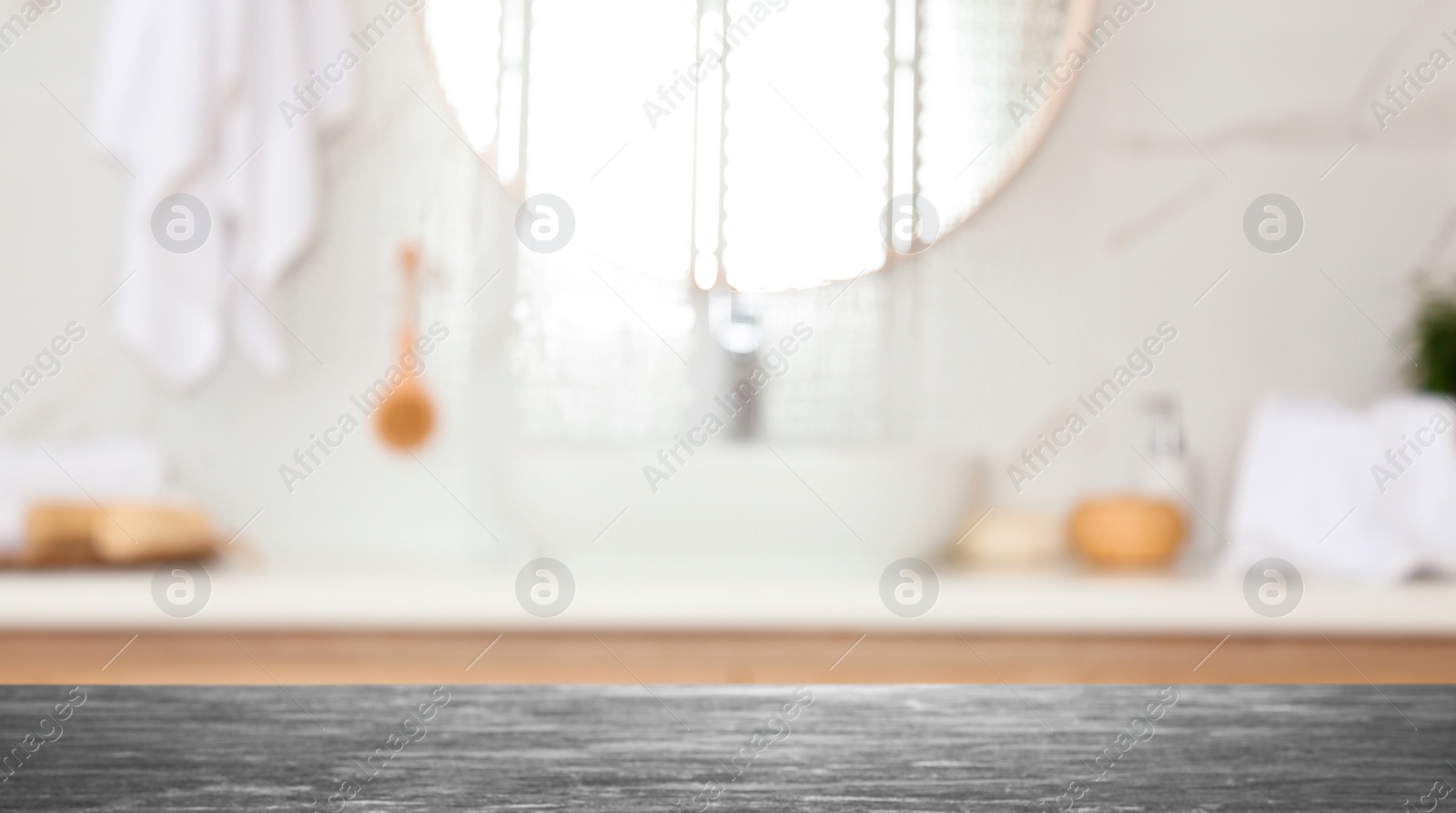 Image of Empty table and blurred view of stylish bathroom interior