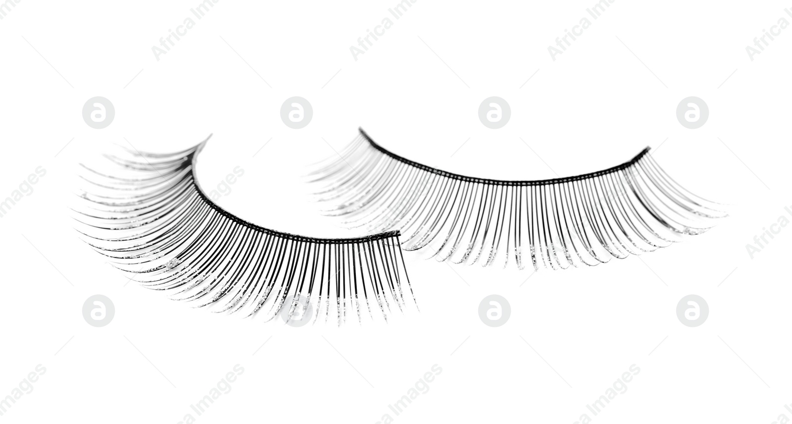 Photo of Fake eyelashes on white background. Makeup product