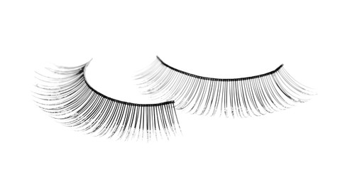 Photo of Fake eyelashes on white background. Makeup product