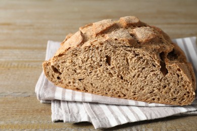 Freshly baked sourdough bread on wooden table