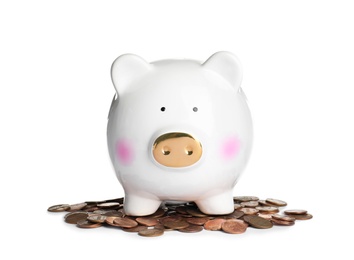 Photo of Piggy bank with coins on white background