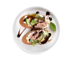 Photo of Delicious bruschettas with balsamic vinegar and toppings isolated on white, top view