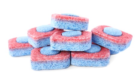 Photo of Pile of dishwasher detergent tablets on white background