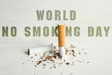 Image of World No Smoking Day. Broken cigarette on white table