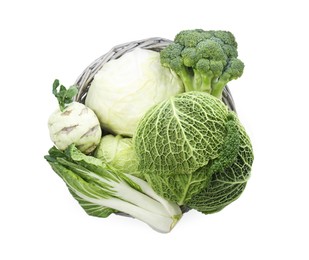 Wicker basket with different types of fresh cabbage on white background, top view