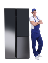 Photo of Professional worker near refrigerator on white background