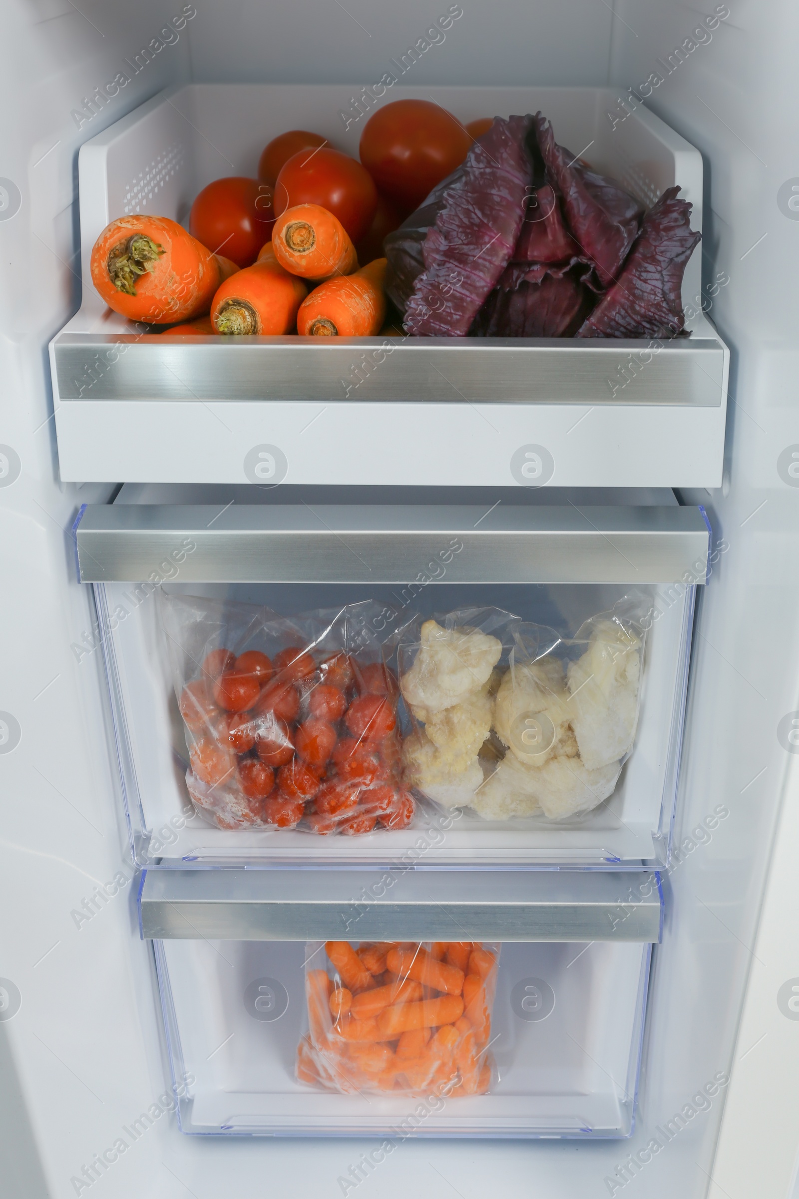 Photo of Open refrigerator full of different fresh products