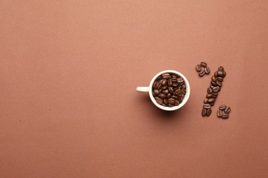 Photo of 0 percent made of cup and coffee beans on color background, flat lay with space for text. Decaffeinated drink