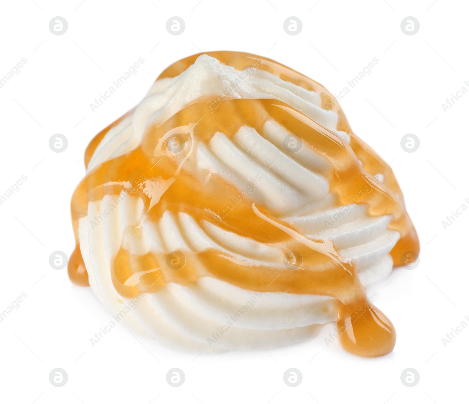 Photo of Delicious fresh whipped cream with caramel sauce isolated on white