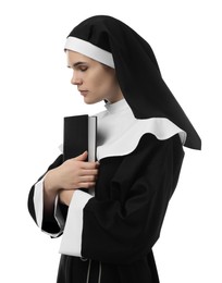 Photo of Young nun holding Bible on white background