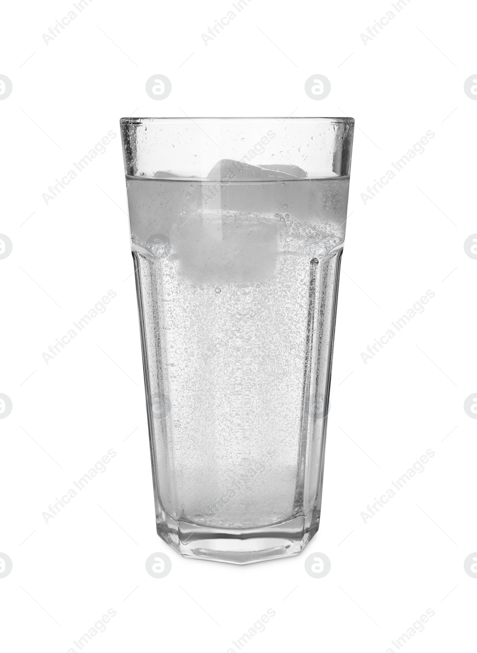 Photo of Glass of refreshing soda water with ice cubes isolated on white