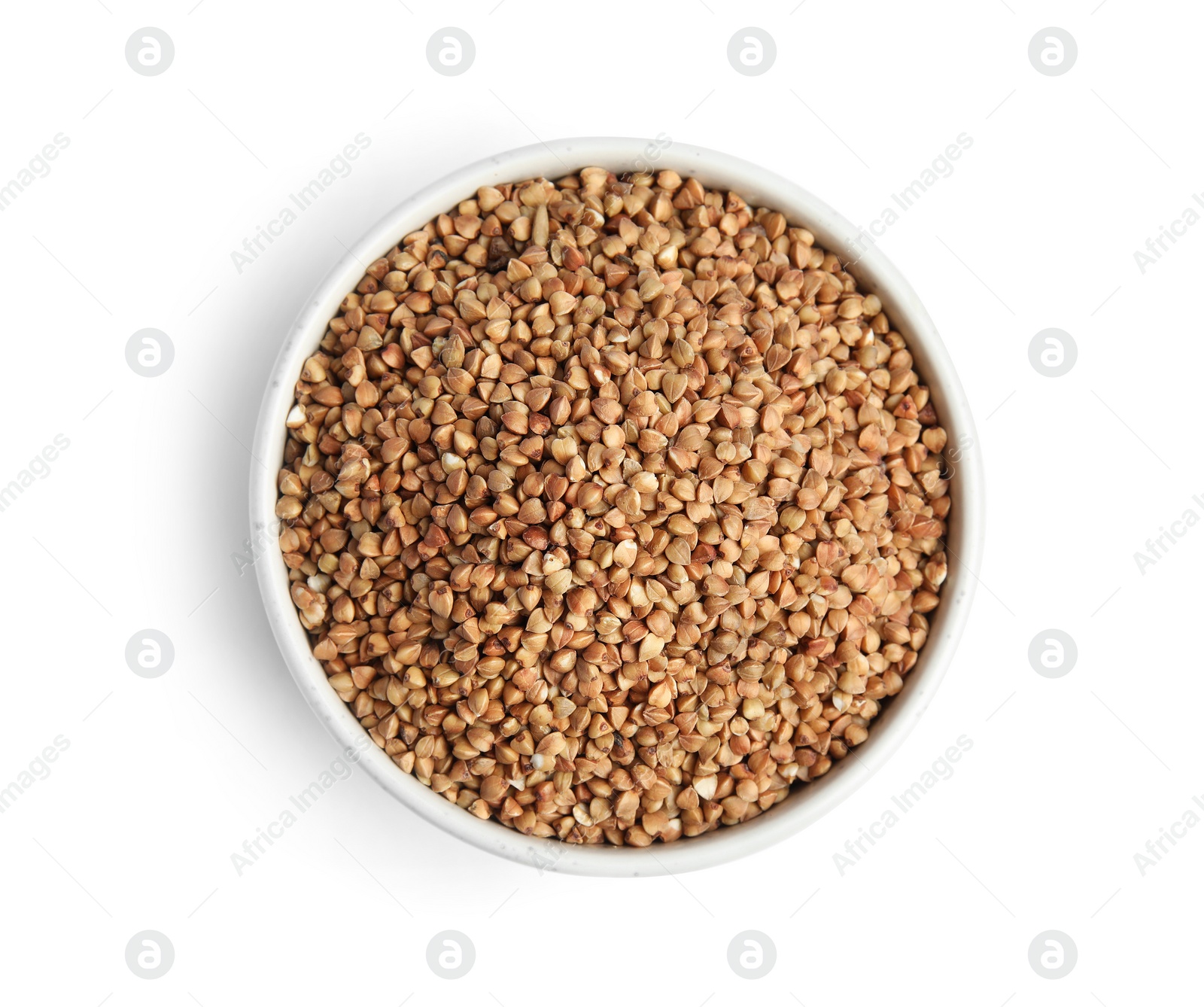 Photo of Bowl with uncooked buckwheat on white background, top view