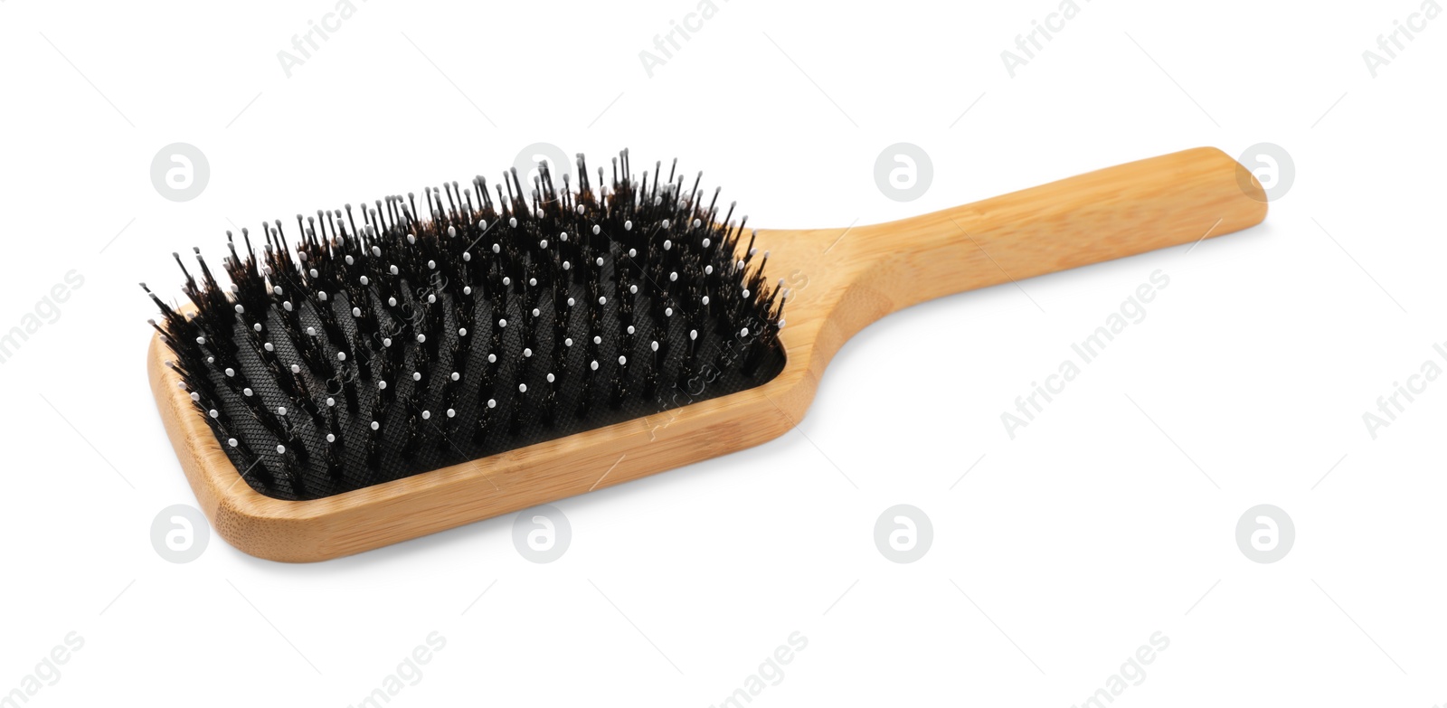 Photo of New wooden hair brush isolated on white