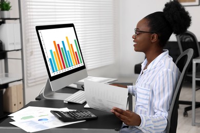 Photo of Professional accountant working at desk in office