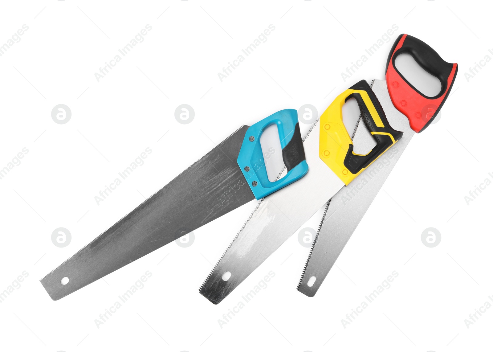 Photo of Saws with colorful handles isolated on white, top view