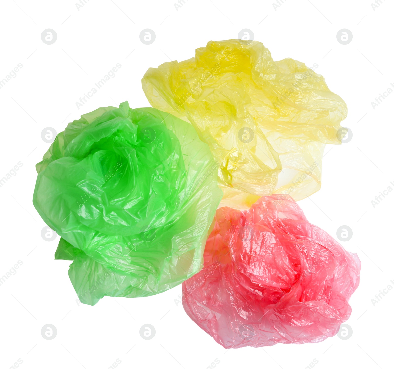 Photo of Crumpled plastic bags isolated on white, top view