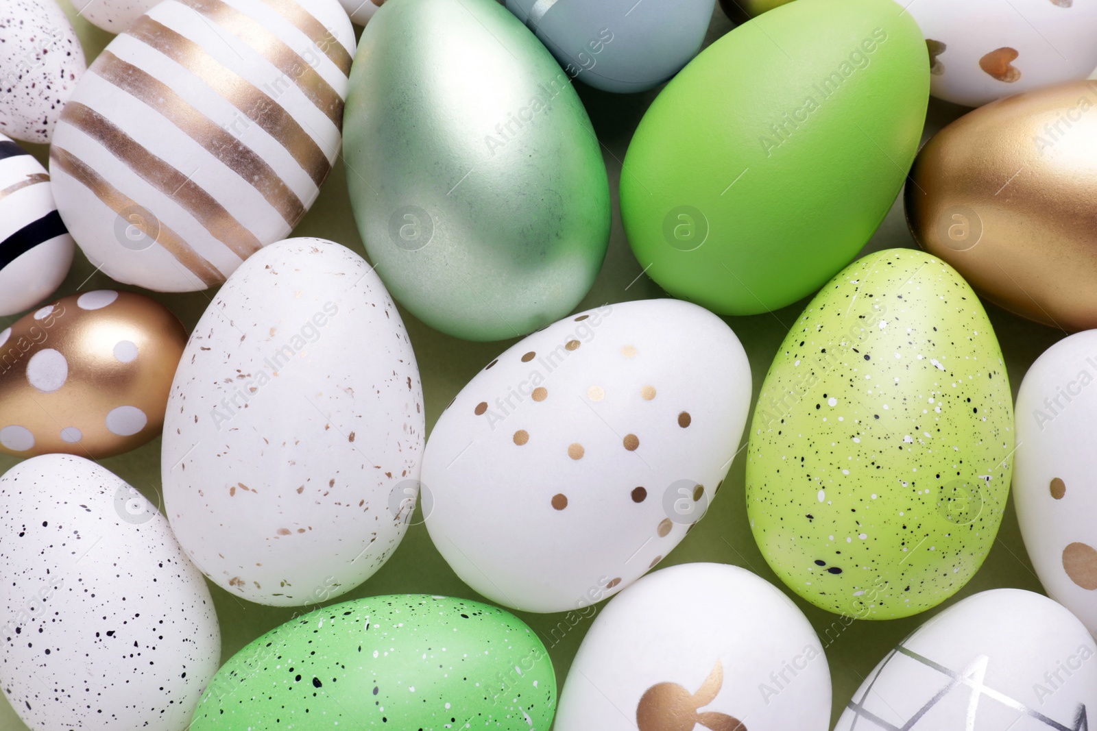 Photo of Beautifully painted Easter eggs as background, top view