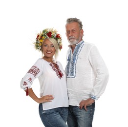 Photo of Happy mature couple in Ukrainian national clothes on white background