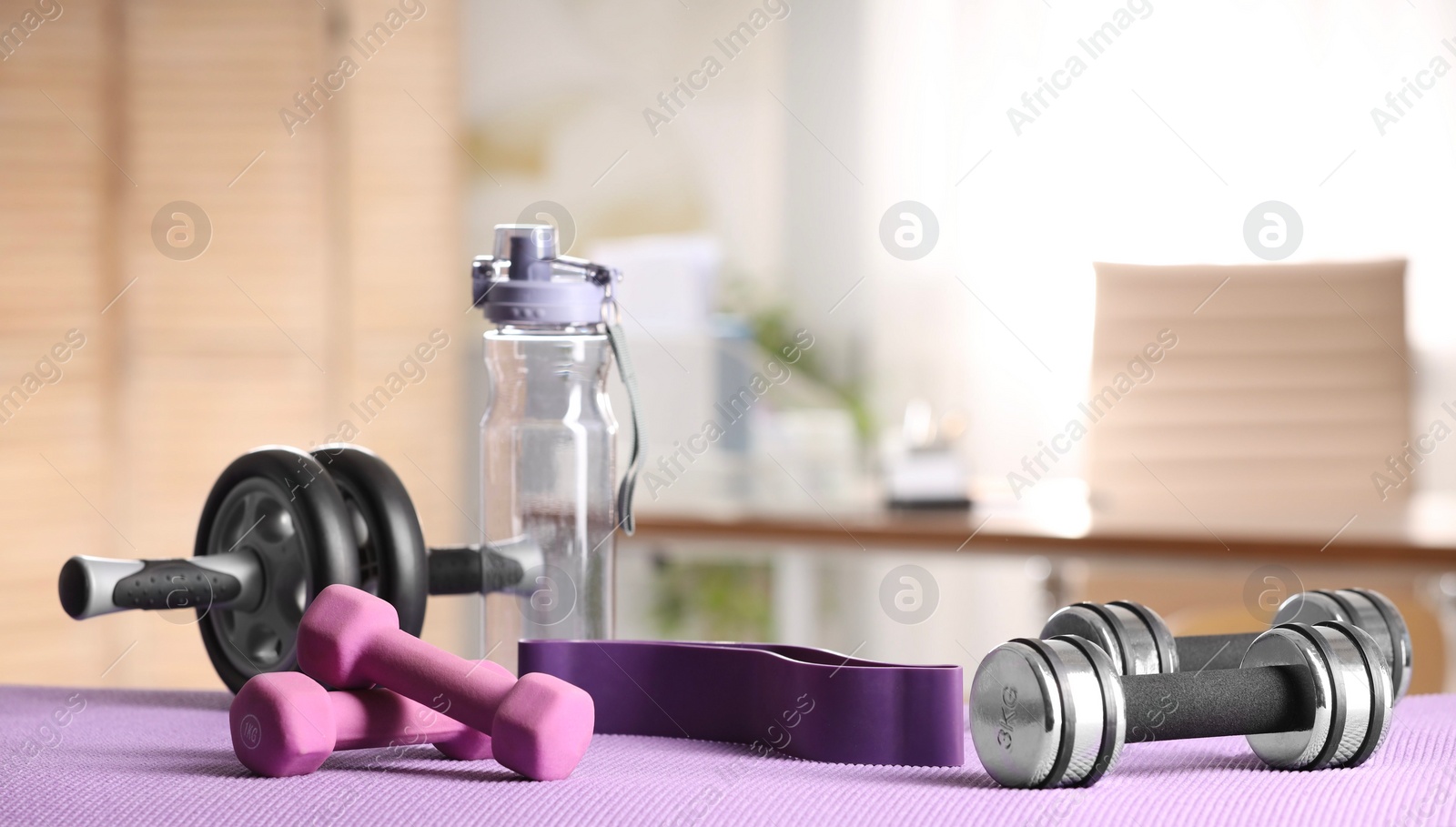 Photo of Many different sports equipment on mat indoors, banner design