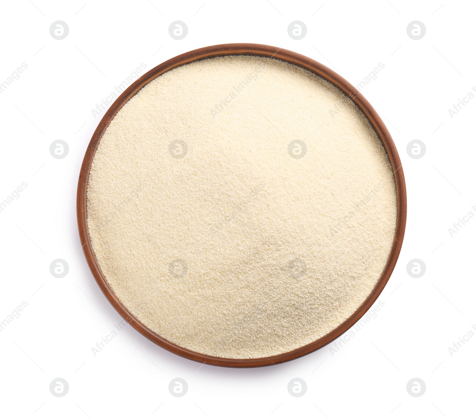 Photo of Bowl of uncooked organic semolina isolated on white, top view