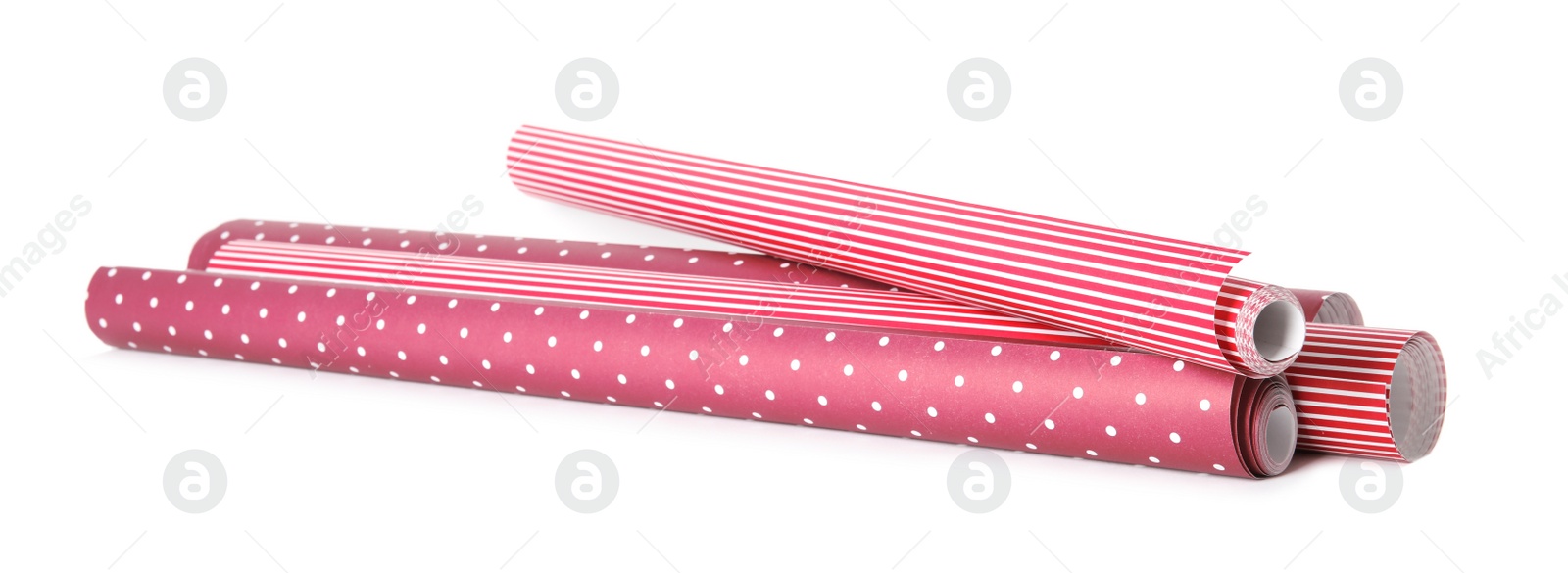 Photo of Different colorful wrapping paper rolls on white background