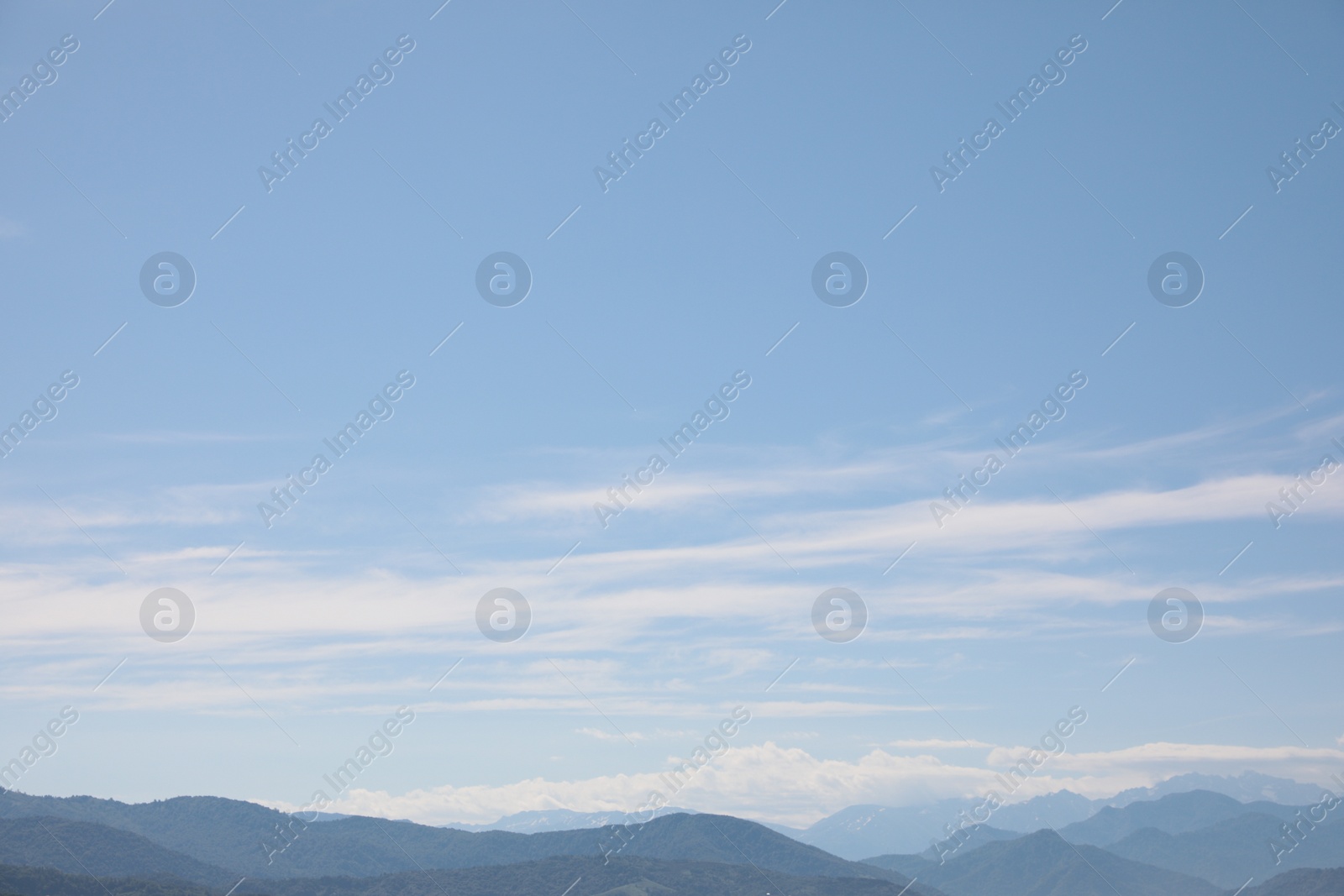 Photo of Picturesque view of mountain landscape and blue sky with clouds