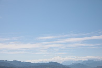 Picturesque view of mountain landscape and blue sky with clouds