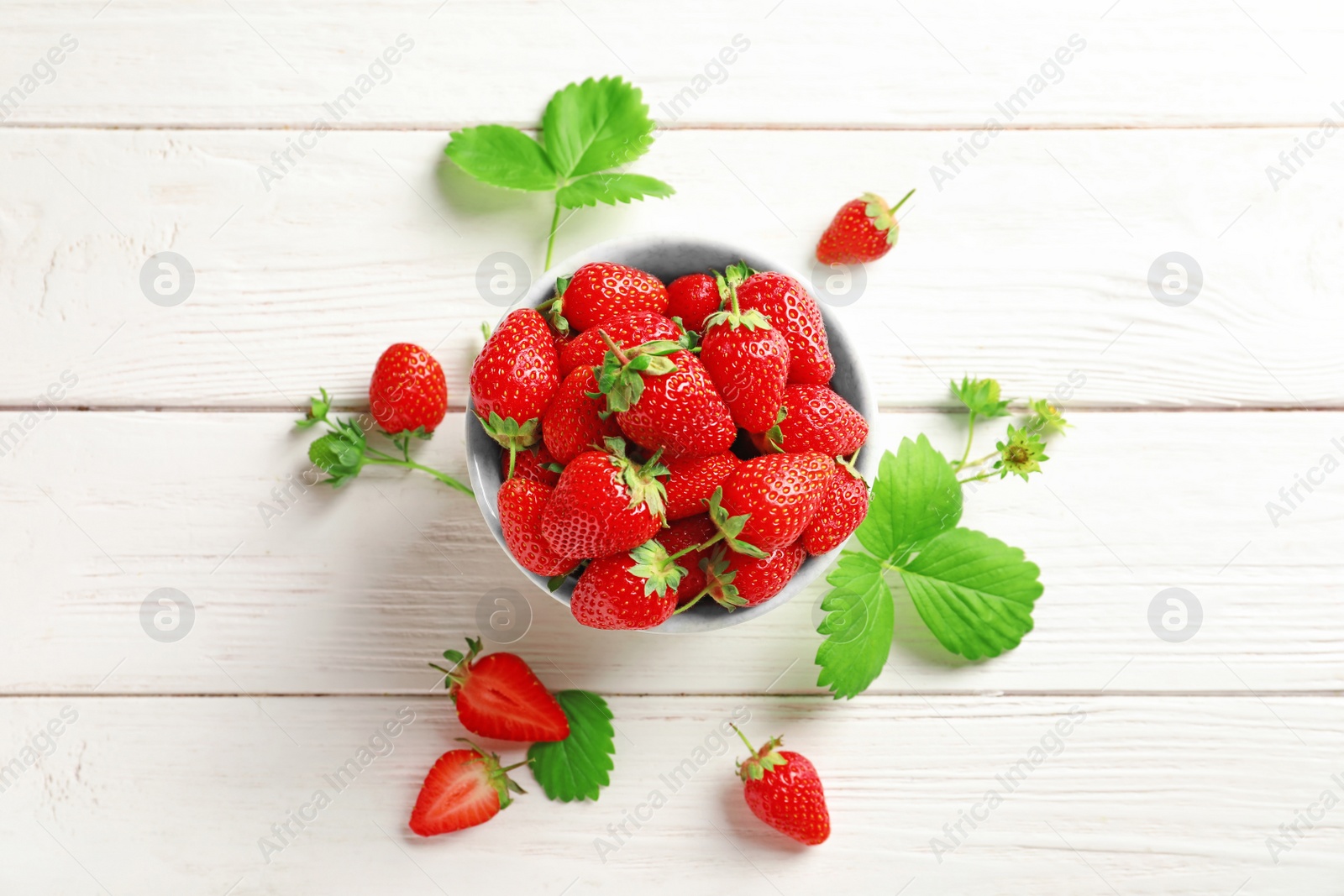 Photo of Flat lay composition with fresh strawberries on wooden background