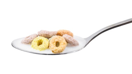 Cereal rings and milk in spoon isolated on white