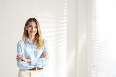Photo of Portrait of beautiful young businesswoman in office