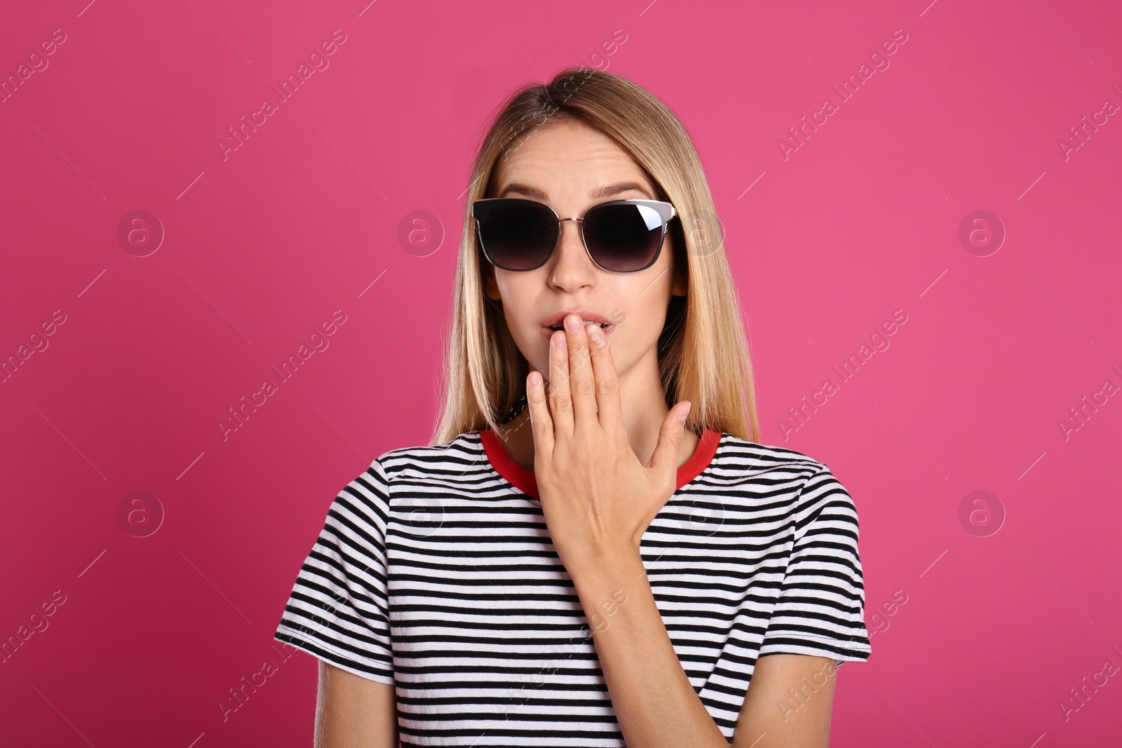 Photo of Beautiful woman in stylish sunglasses on pink background