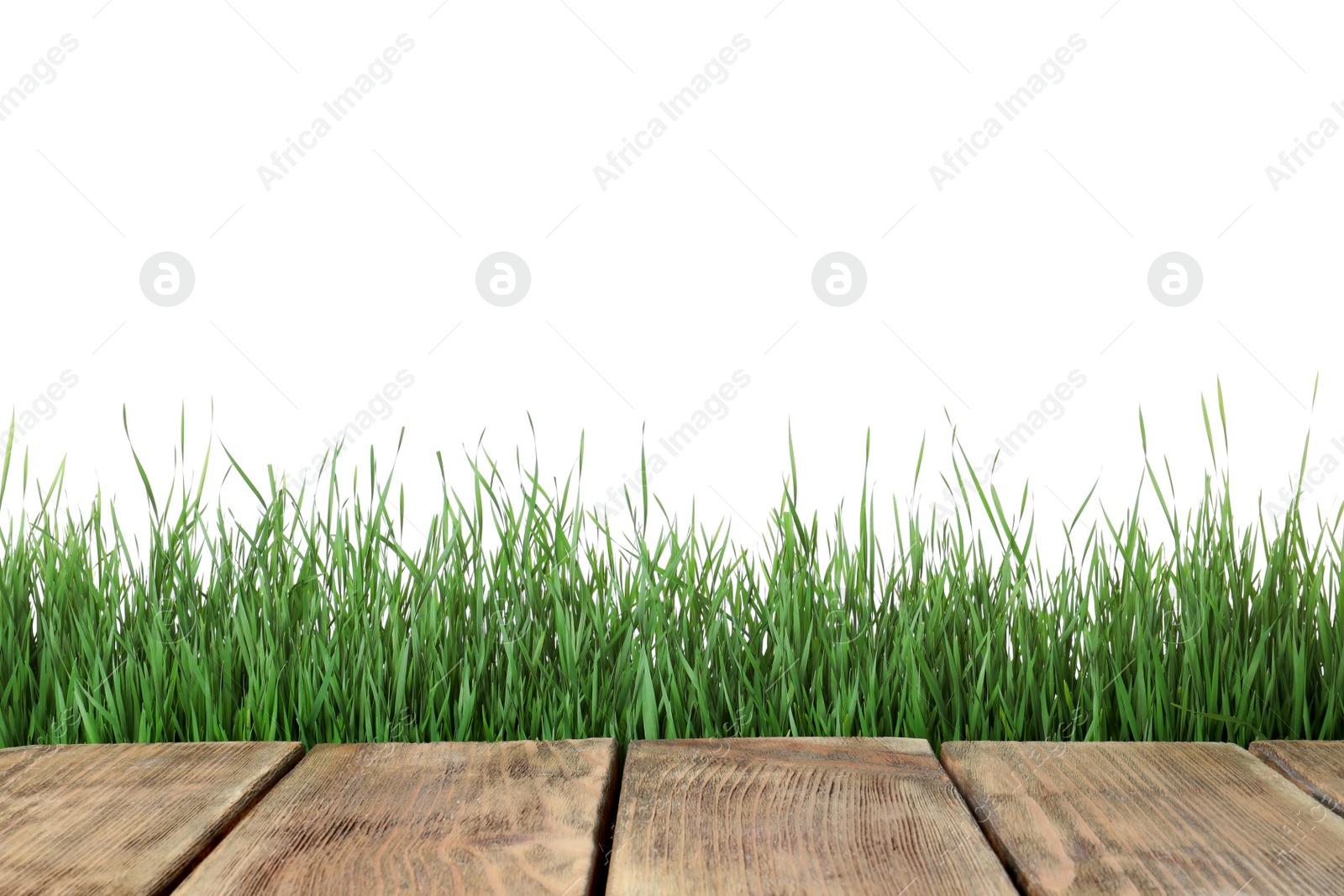 Photo of Wooden deck and green grass isolated on white