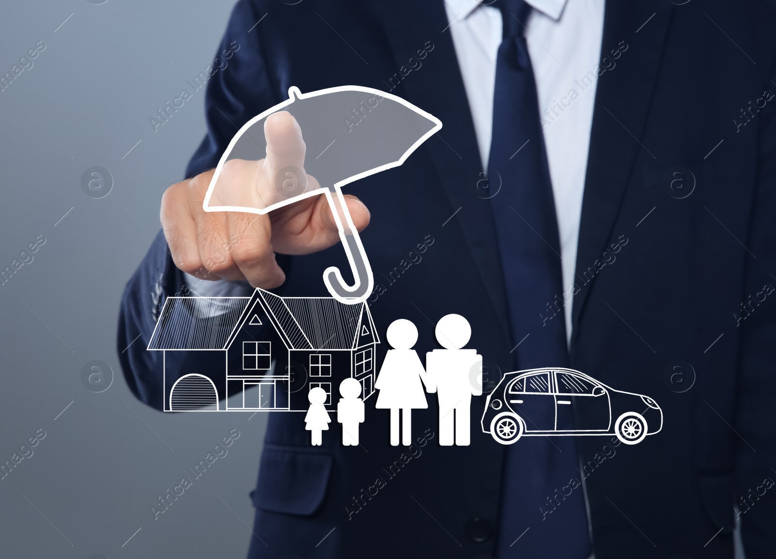 Image of Insurance concept - umbrella demonstrating protection. Man using virtual screen with illustrations, closeup