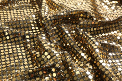 Closeup view of golden shiny sequin fabric as background