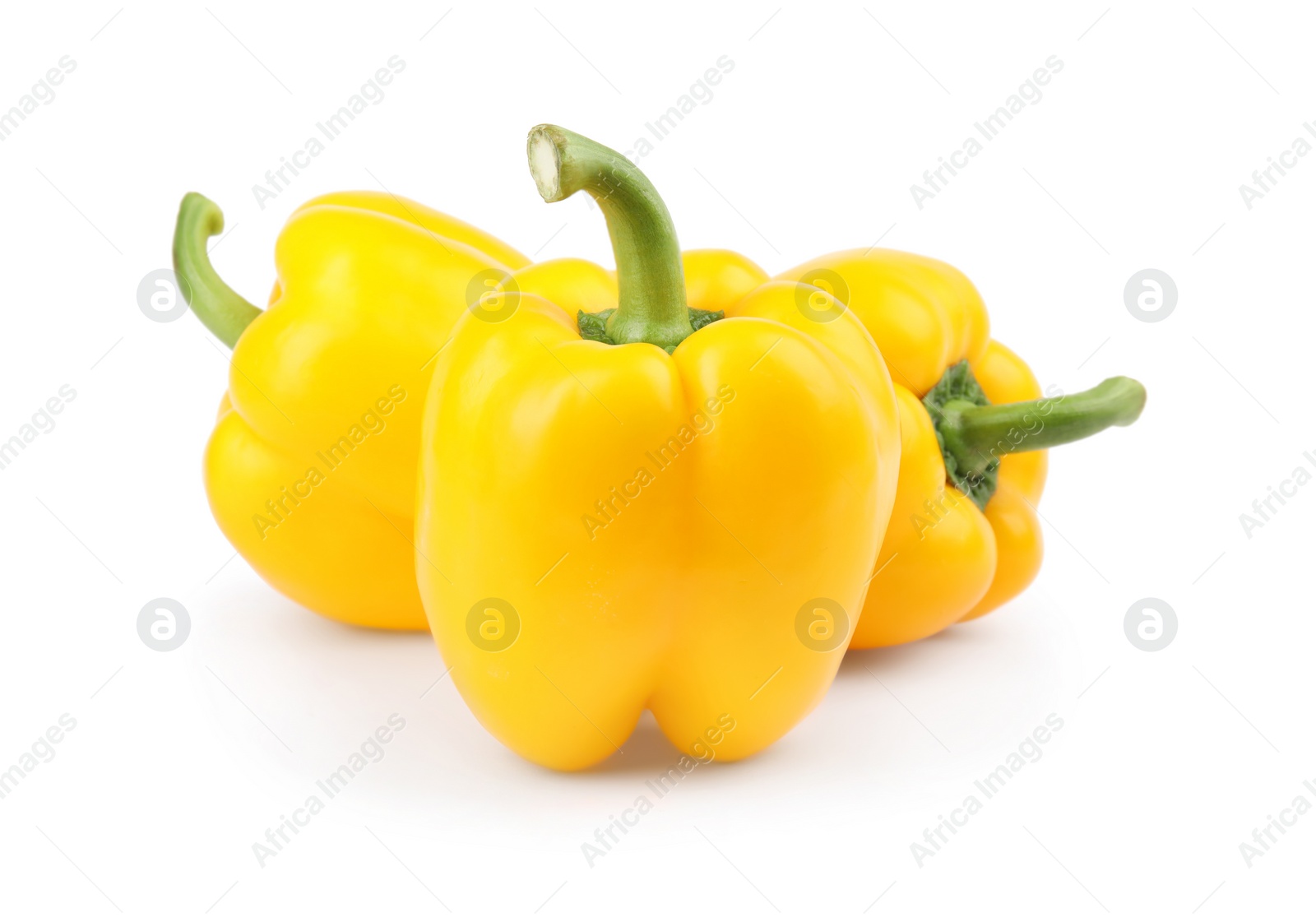 Photo of Ripe yellow bell peppers isolated on white