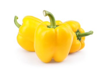 Photo of Ripe yellow bell peppers isolated on white