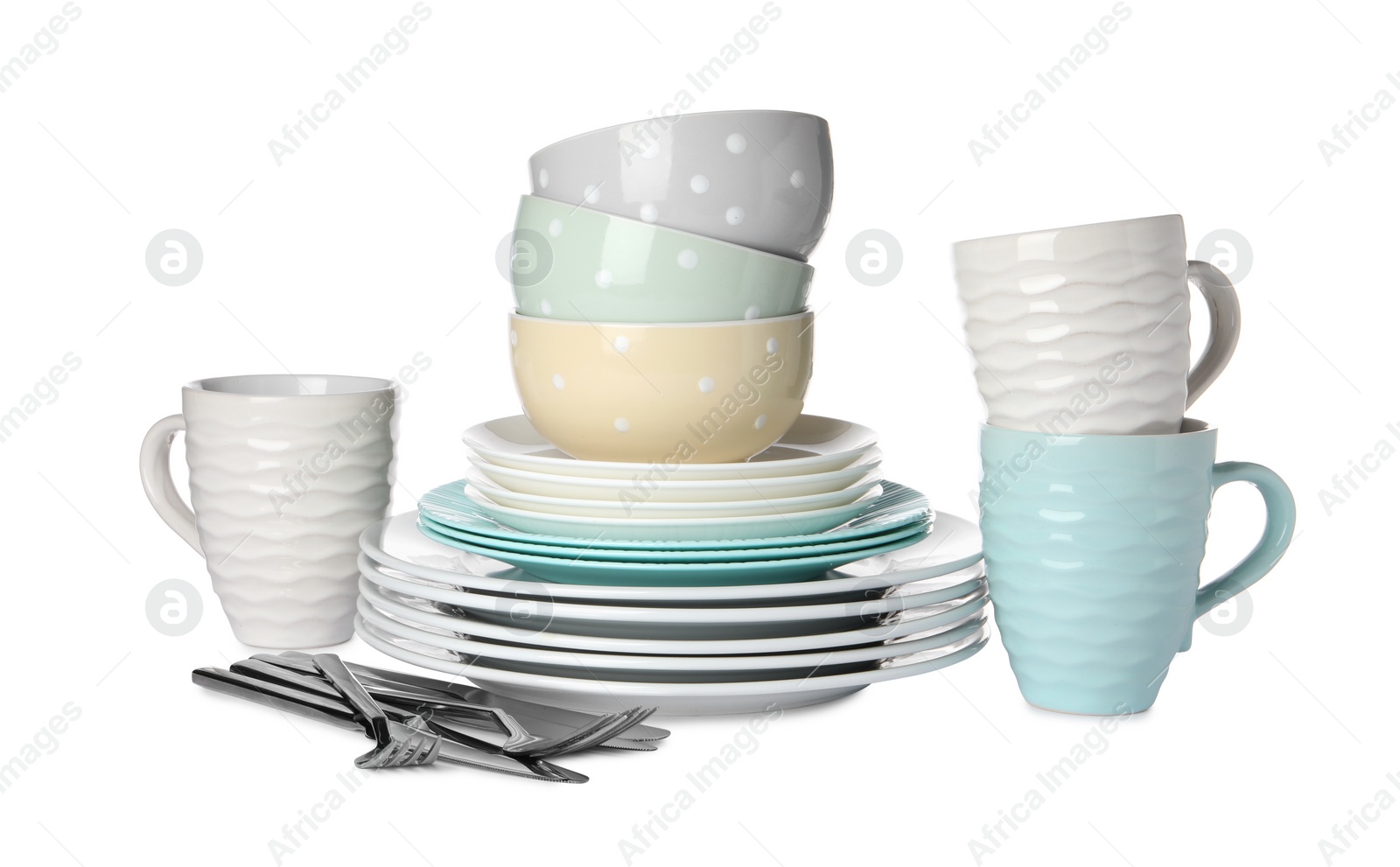 Photo of Set of beautiful ceramic dishware and cutlery isolated on white