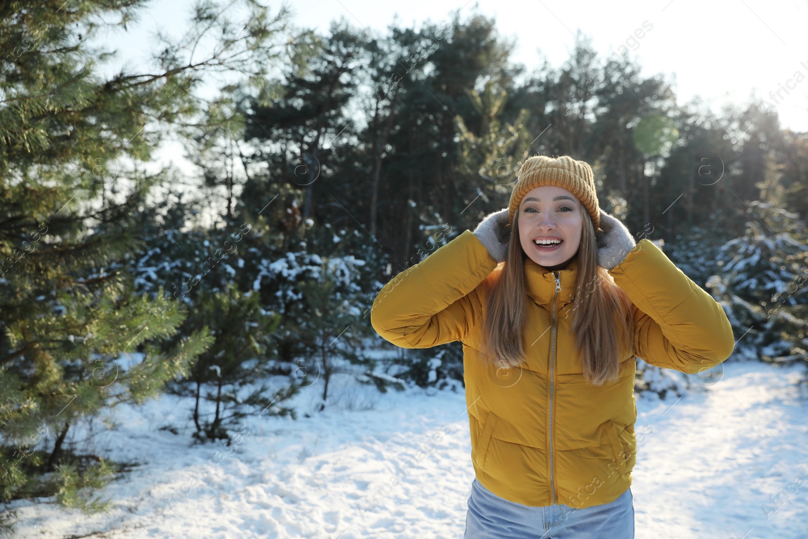 Photo of Woman enjoying winter day in forest, space for text