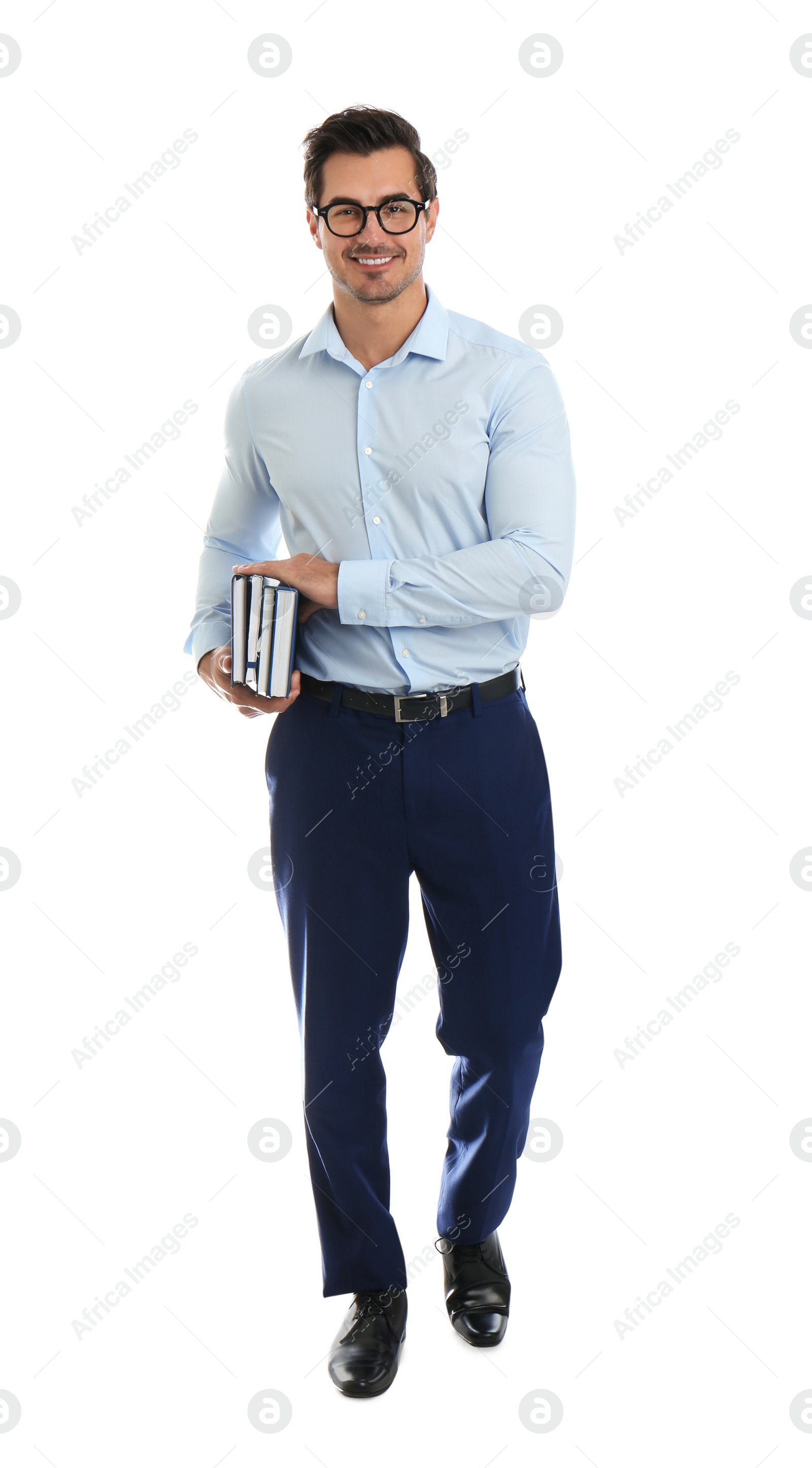 Photo of Young male teacher with glasses and books on white background