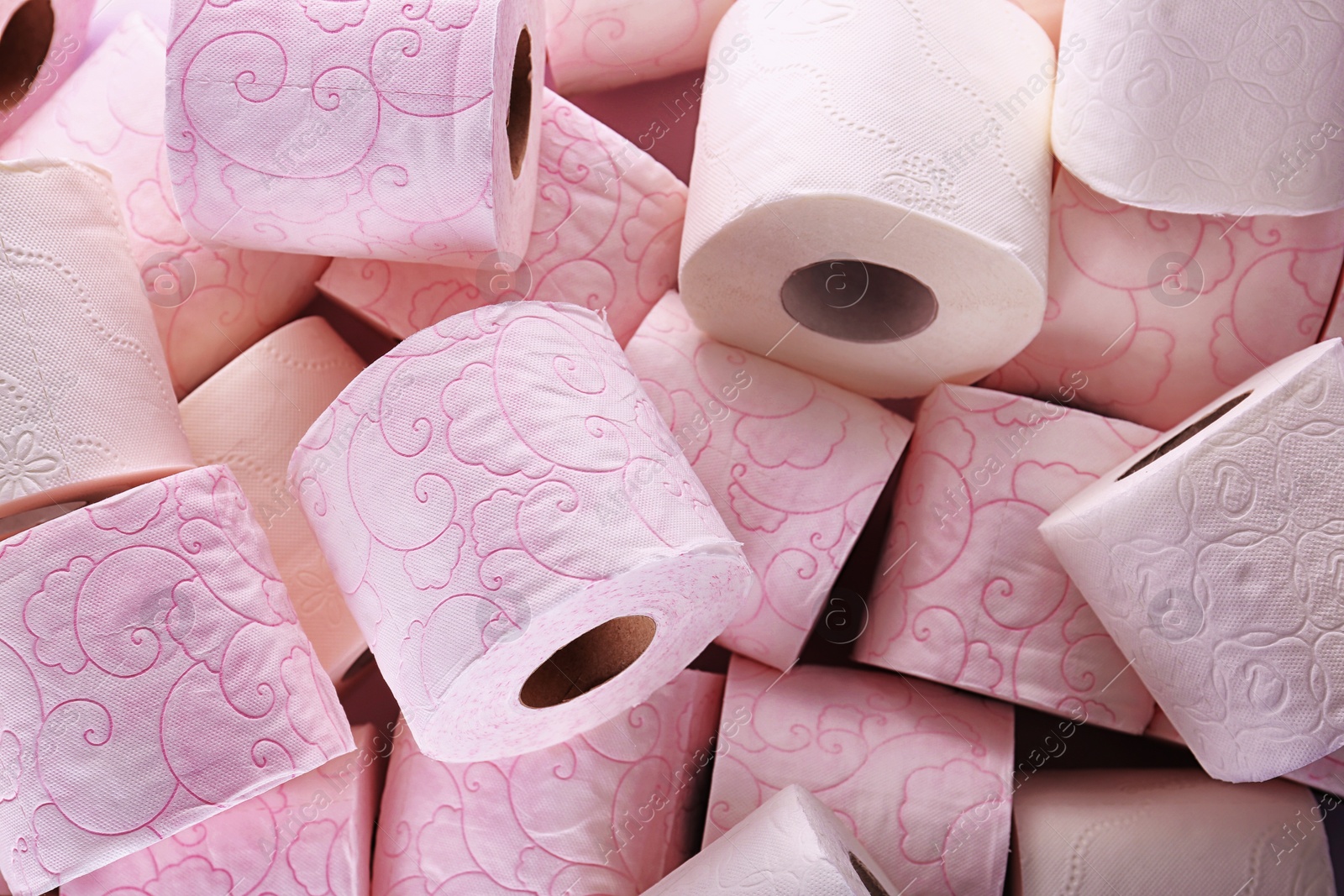 Photo of Many rolls of toilet paper as background. Personal hygiene