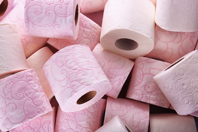 Photo of Many rolls of toilet paper as background. Personal hygiene