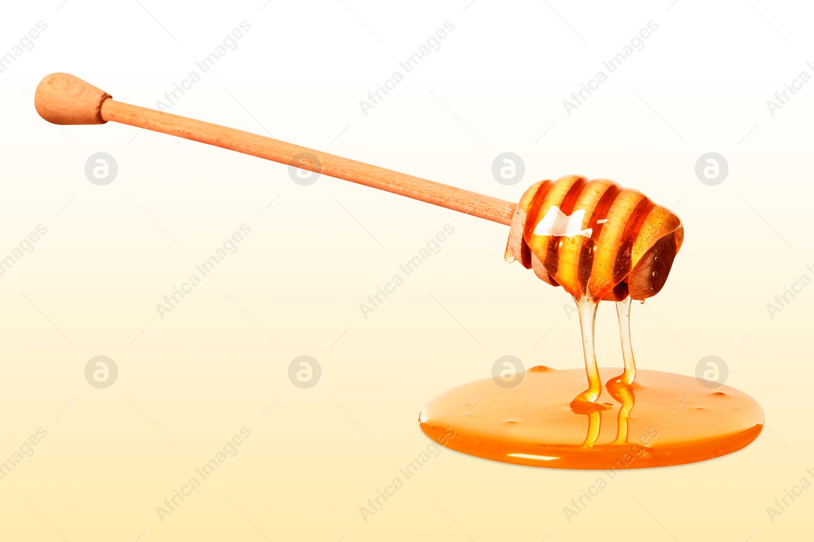 Image of Natural honey dripping from dipper on beige background