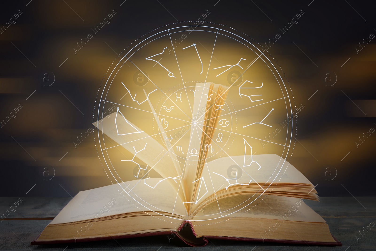 Image of Open book on wooden table and illustration of zodiac wheel with astrological signs