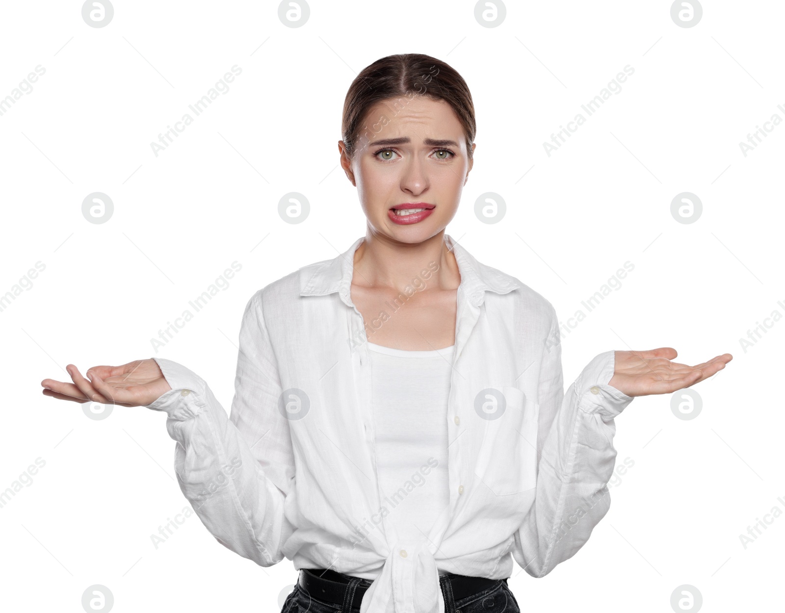 Photo of Embarrassed young woman in shirt on white background