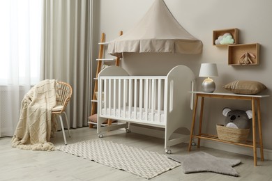 Modern baby room interior with stylish crib