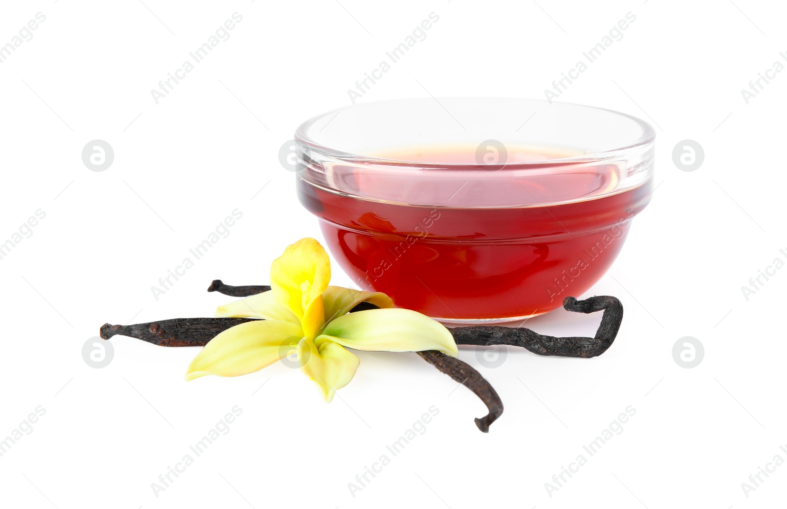 Photo of Vanilla extract, flower and dry pods isolated on white