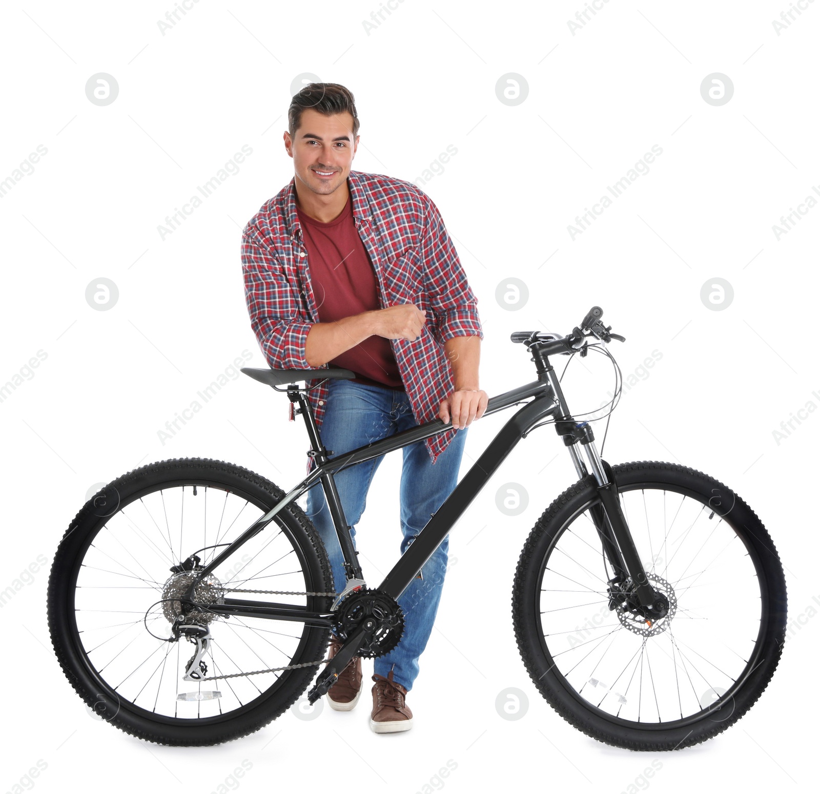 Photo of Handsome young man with modern bicycle on white background