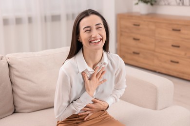 Photo of Portrait of beautiful woman laughing in room