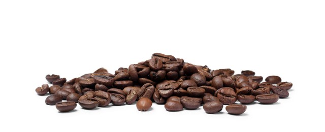 Photo of Pile of roasted coffee beans on white background